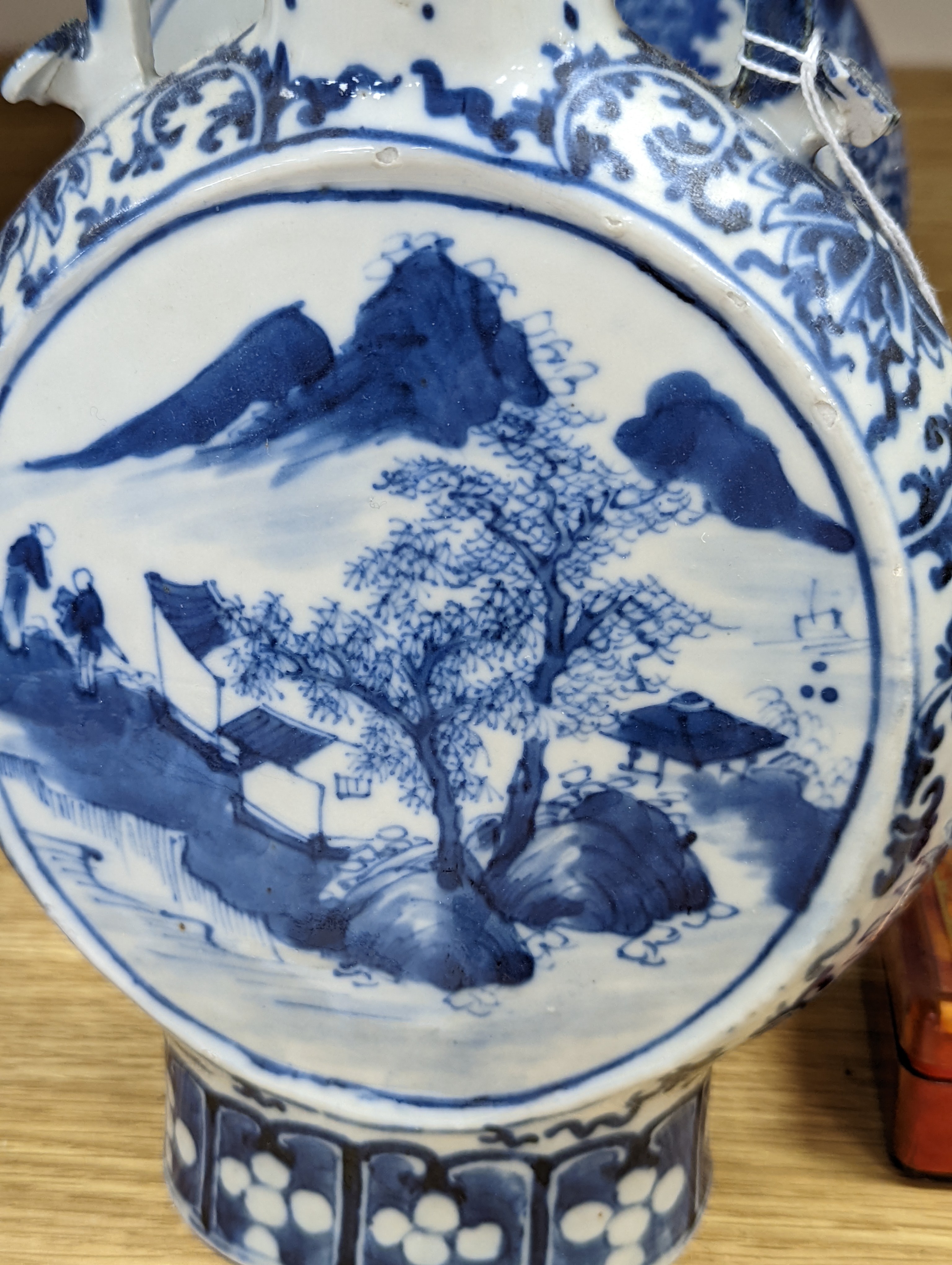Three 19th century Chinese blue and white Moon flasks, tallest 31 cms.